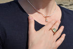 Charger l&#39;image dans la galerie, Découvrez la magie du collier scarabée en perles d&#39;eau douce dans cette photo envoûtante. Les perles scintillantes se mêlent avec grâce, créant un spectacle de lumière éblouissant. Le pendentif scarabée, symbole mystique, attire tous les regards avec ses détails sublimes. Cette image capture l&#39;essence même de ce bijou d&#39;exception, offrant une invitation à l&#39;émerveillement. Laissez-vous charmer par la beauté intemporelle de ce collier unique.
